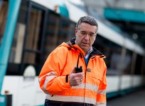 Man in high-vis jacket with radio